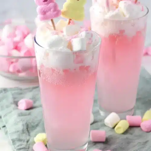 Easter Bunny Punch Recipe That’s Sweet, Fizzy, and Fun 3 Layered pink Easter Bunny Punch with marshmallows and bunny candy topper
