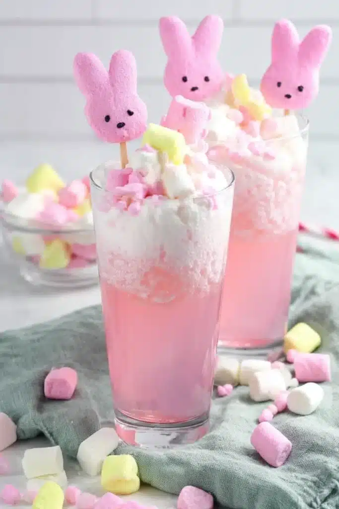 Easter Bunny Punch Recipe That’s Sweet, Fizzy, and Fun 2 Layered pink Easter Bunny Punch with marshmallows and bunny candy topper