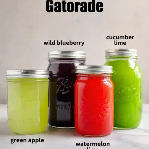 Natures Gatorade Recipe That’s Simple, Fresh, and Healthy 4 Four colorful homemade Nature’s Gatorade drinks in glass jars on a light countertop