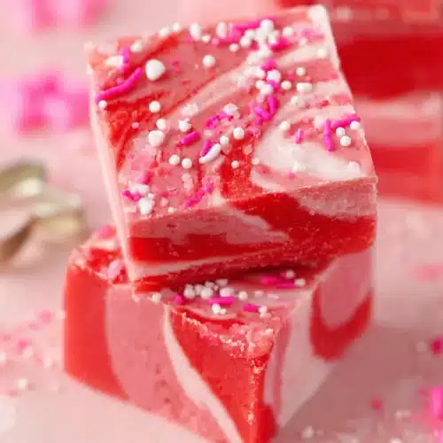 Valentine strawberry fudge with pink and red swirls topped with sprinkles