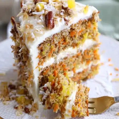 To Die For Carrot Cake 3 Slice of To Die For Carrot Cake with cream cheese frosting and pecans