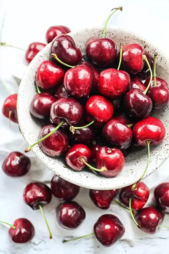 Fresh cherries for Cherry Walnut Couscous Salad in ceramic bowl