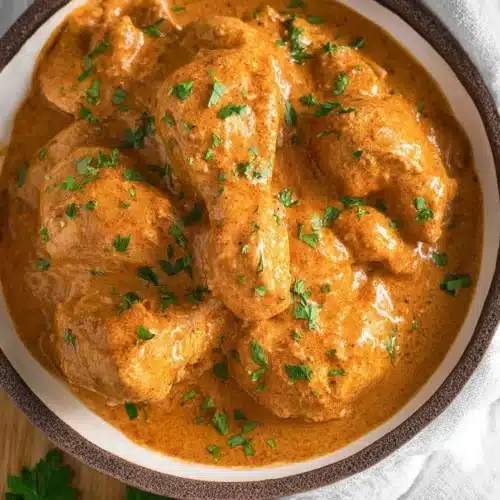 Chicken Paprikash Recipe: Creamy, Cozy, and Easy Dinner 6 Creamy Chicken Paprikash with tender chicken in rich paprika sauce garnished with parsley