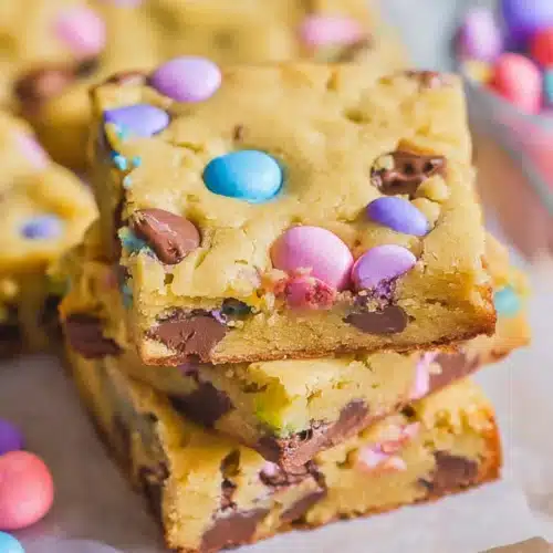Easter Cake Mix Cookie Bars 3 Easter cake mix cookie bars with pastel M&M candies and chocolate chips