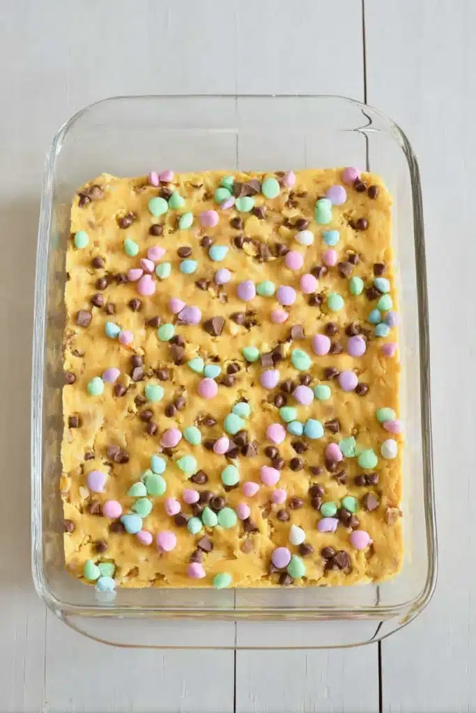 Easter Cake Mix Cookie Bars 2 Easter Cake Mix Cookie Bars baked in glass pan with pastel candies