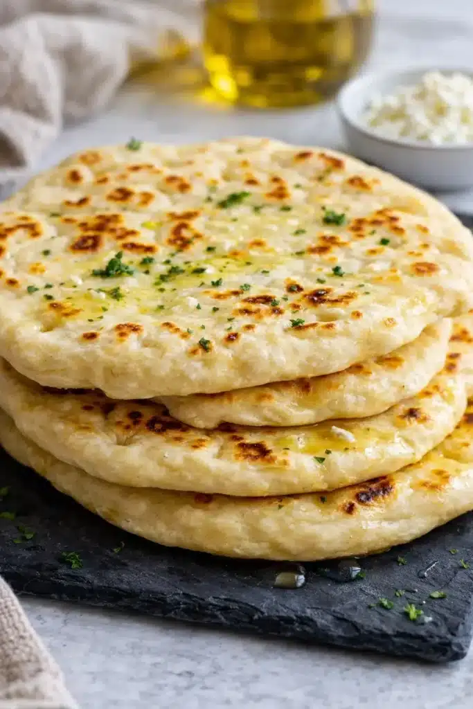 Cottage Cheese Flatbread Recipe That’s Soft, Easy, and High Protein 2 Stacked Cottage Cheese Flatbread with herbs and butter