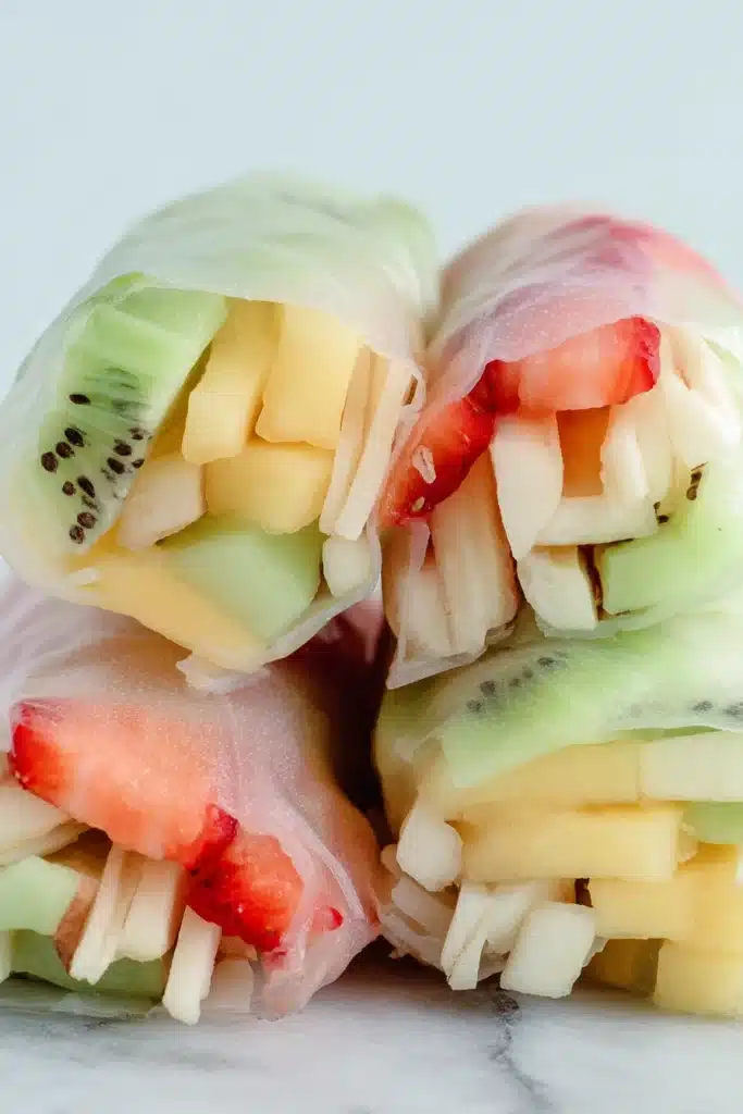 Fresh fruit spring rolls with colorful sliced fruit wrapped in soft rice paper