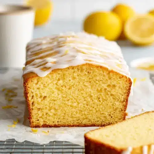 Gluten free lemon drizzle cake loaf with icing glaze and soft moist crumb