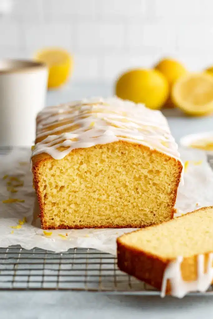 Gluten free lemon drizzle cake loaf with icing glaze and soft moist crumb