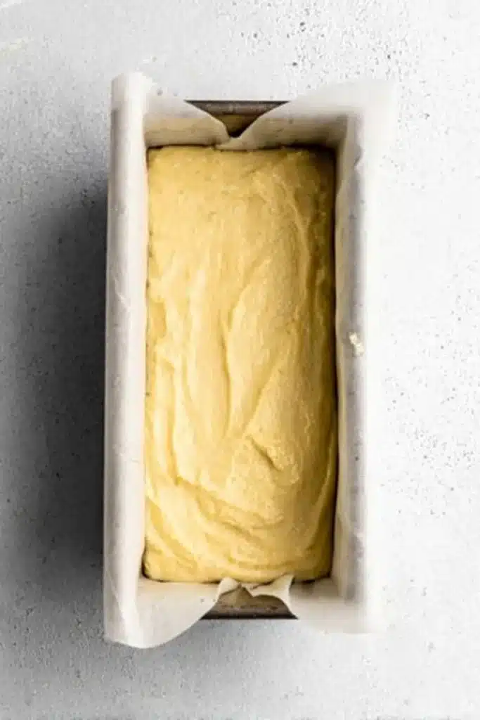Gluten free lemon drizzle cake batter in loaf pan before baking
