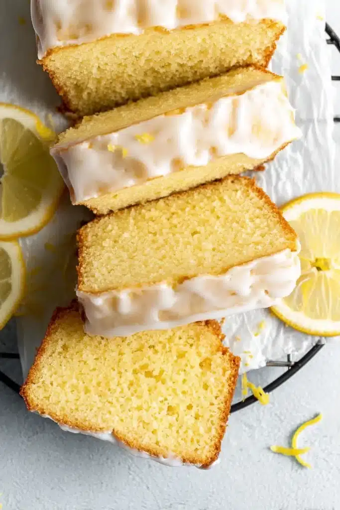 Gluten free lemon drizzle cake slices with icing and soft moist crumb