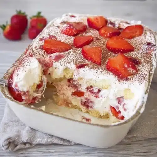 Keto strawberry tiramisu with fresh strawberries and creamy layers in glass dish