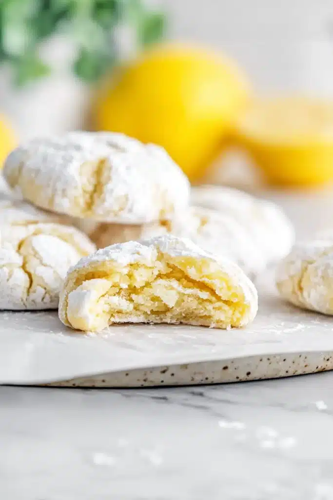 Lemon Crinkle Cookies with soft chewy center and powdered sugar cracks