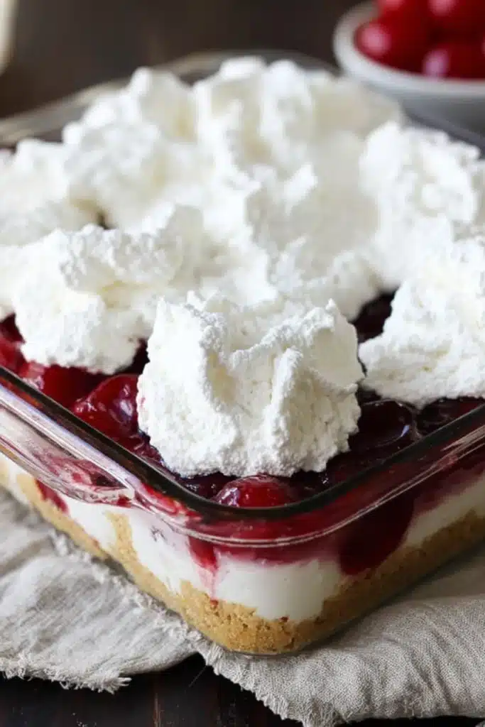 Layering No-Bake Cherry Dessert with Whipped Cream