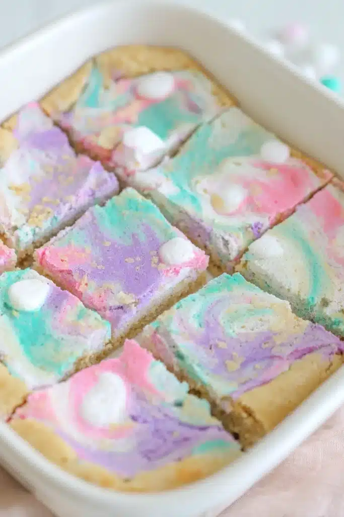 Pastel Peeps sugar cookie bars with gooey marshmallow swirls cut into squares