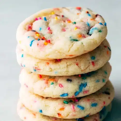Soft Funfetti Cookies 3 Soft funfetti cookies stacked with colorful sprinkles and chewy texture