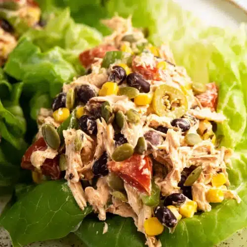 Southwest Chicken Salad 5 Southwest Chicken Salad served in lettuce cups with beans and corn