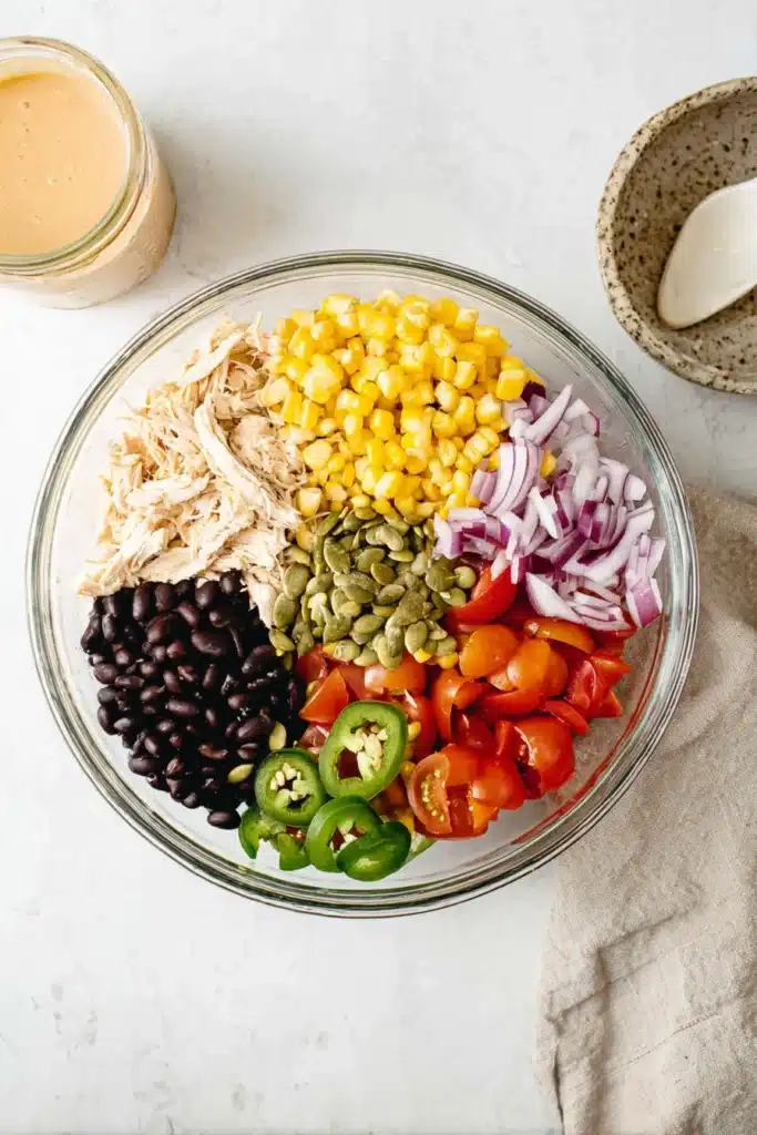 Southwest Chicken Salad 2 Southwest Chicken Salad ingredients with chicken, beans, corn, and vegetables