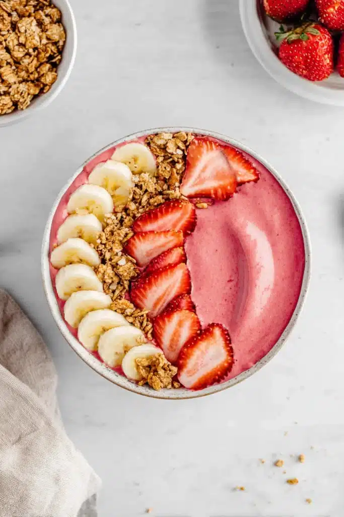 Strawberry Banana Smoothie Bowl with fresh fruit and granola toppings