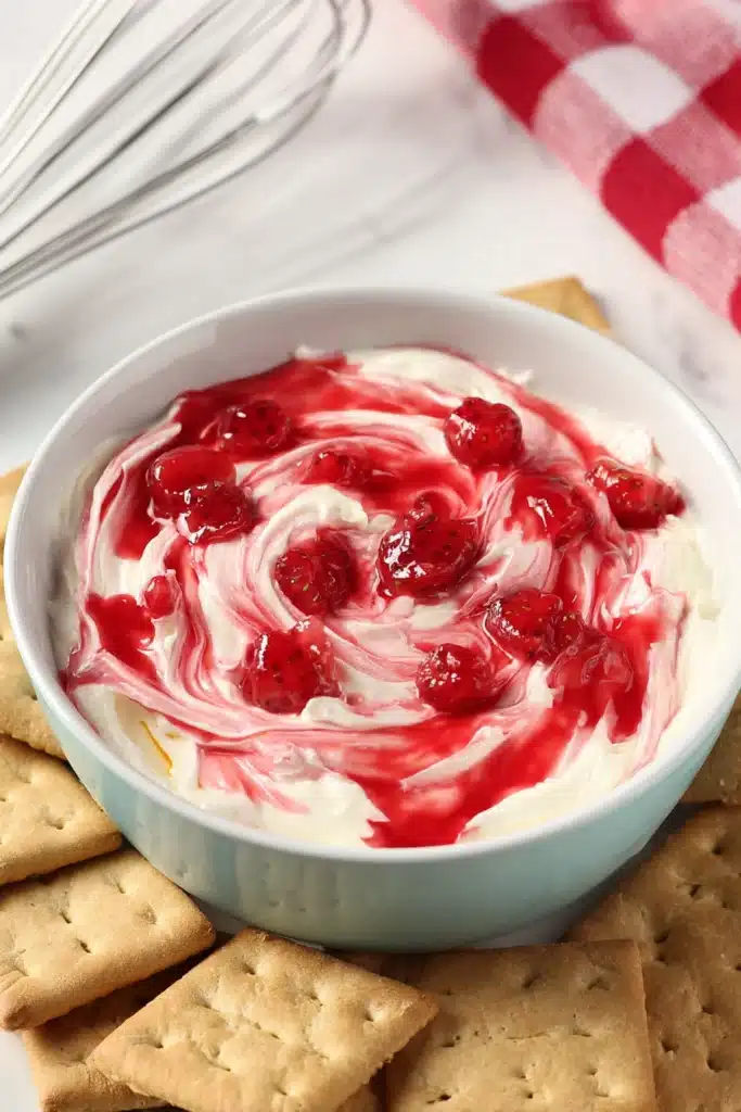 Strawberry Cheesecake Dip 2 Strawberry Cheesecake Dip with graham crackers and glossy strawberry swirl
