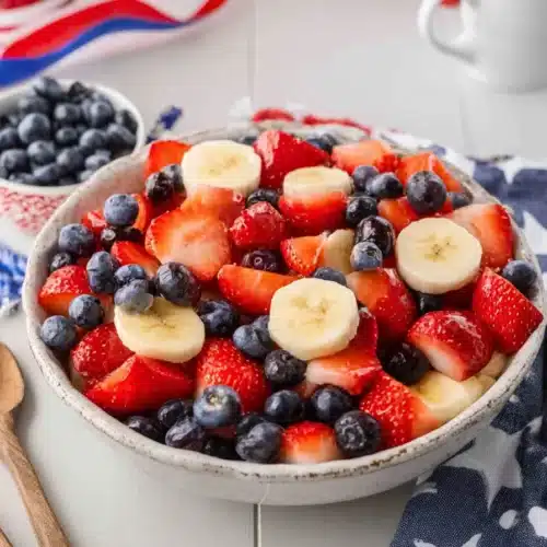 4th of July Fruit Salad 4 4th of July fruit salad with strawberries blueberries and bananas in a bowl