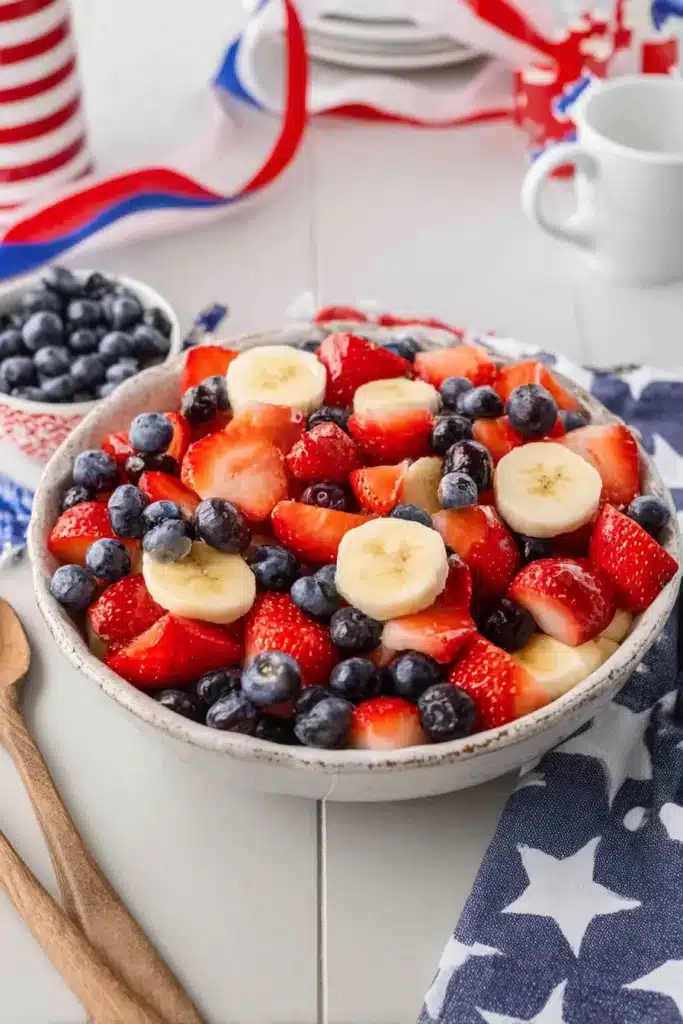 4th of July Fruit Salad 1 4th of July fruit salad with strawberries blueberries and bananas in a bowl
