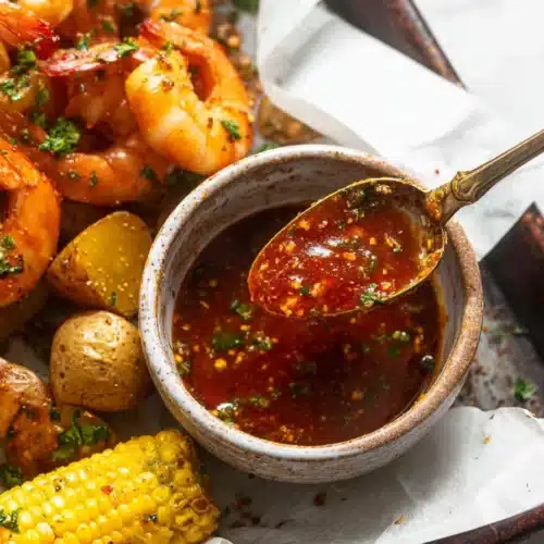 Cajun Garlic Butter Sauce served with shrimp corn and potatoes