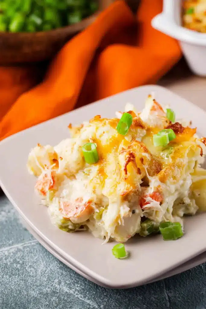 Chinese Buffet Crab Casserole served on plate with melted cheese and green onions
