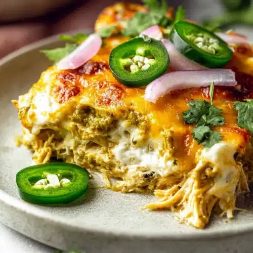 Delicious Salsa Verde Chicken Casserole 4 salsa verde chicken casserole slice with melted cheese and jalapeños