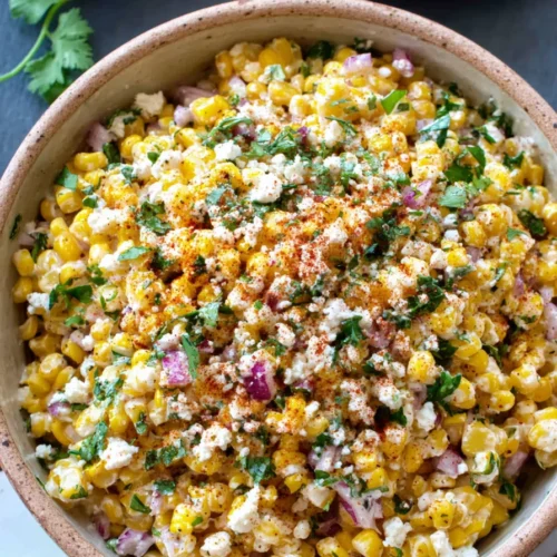 Elote Corn Salad Recipe for a Creamy and Flavorful Side 4 Elote corn salad with creamy dressing, cotija cheese, and fresh herbs in a bowl