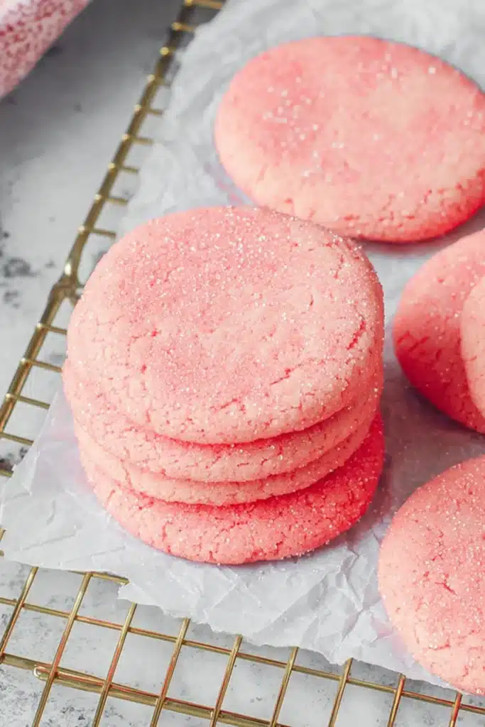 Mexican Pink Cookies Recipe That’s Soft, Buttery, and Easy 1 Mexican pink cookies with sugar topping on parchment paper cooling rack