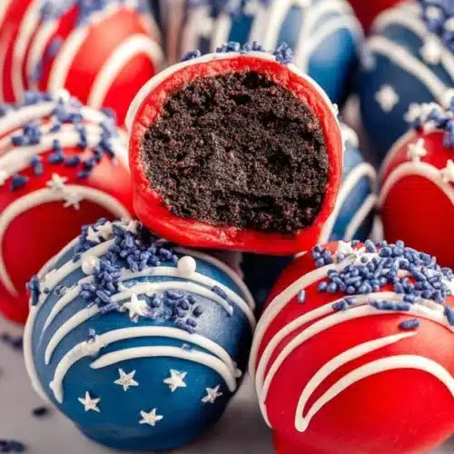Patriotic Oreo balls with red white blue coating and creamy chocolate center