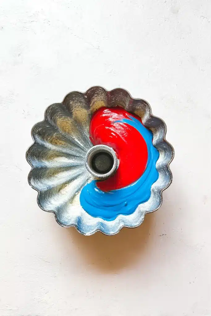 Red White And Blue Marble Cake batter in bundt pan before baking