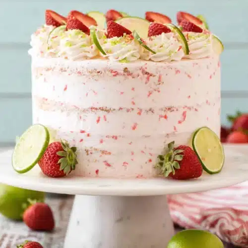Strawberry Margarita Layer Cake 4 Strawberry margarita layer cake with lime slices and fresh strawberries on top