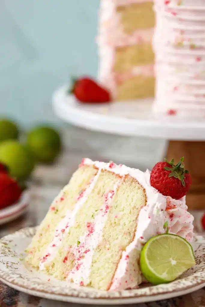 Strawberry Margarita Layer Cake 2 Slice of Strawberry Margarita Layer Cake with lime and strawberry garnish