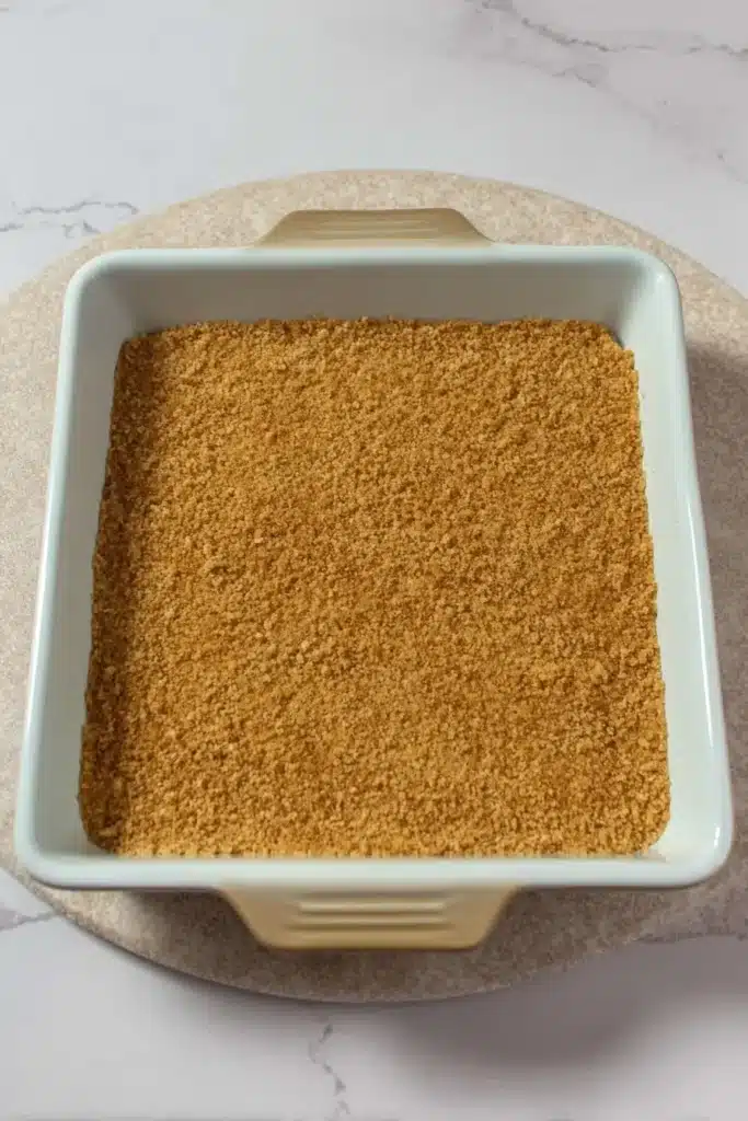 Classic Cherry Delight graham cracker crust pressed into baking dish