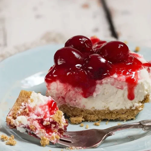 Classic Cherry Delight slice with creamy layers and glossy cherry topping
