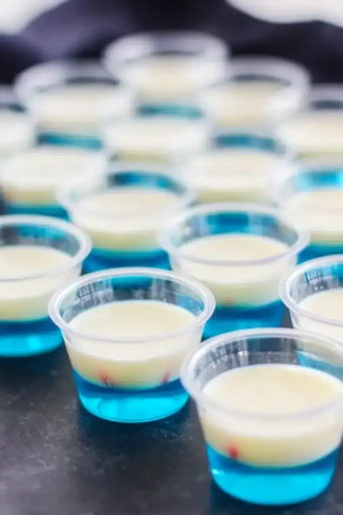 Red White & Blue Jello Shots with blue and white layers in clear cups