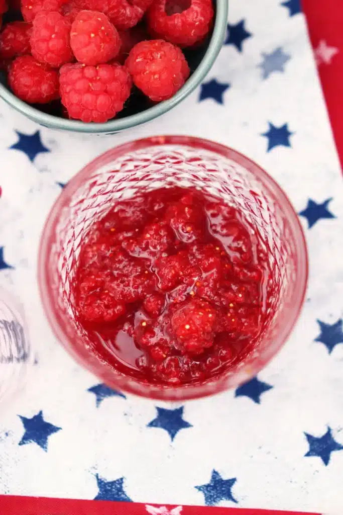 4th Of July Mojito raspberry base with crushed fresh berries in a festive glass