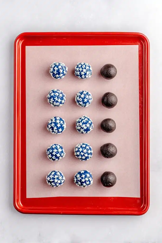 4th Of July Oreo Balls 3 4th Of July Oreo Balls arranged on a baking tray before decorating