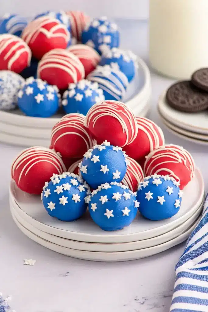 4th Of July Oreo Balls 5 4th Of July Oreo Balls served on festive patriotic dessert plates