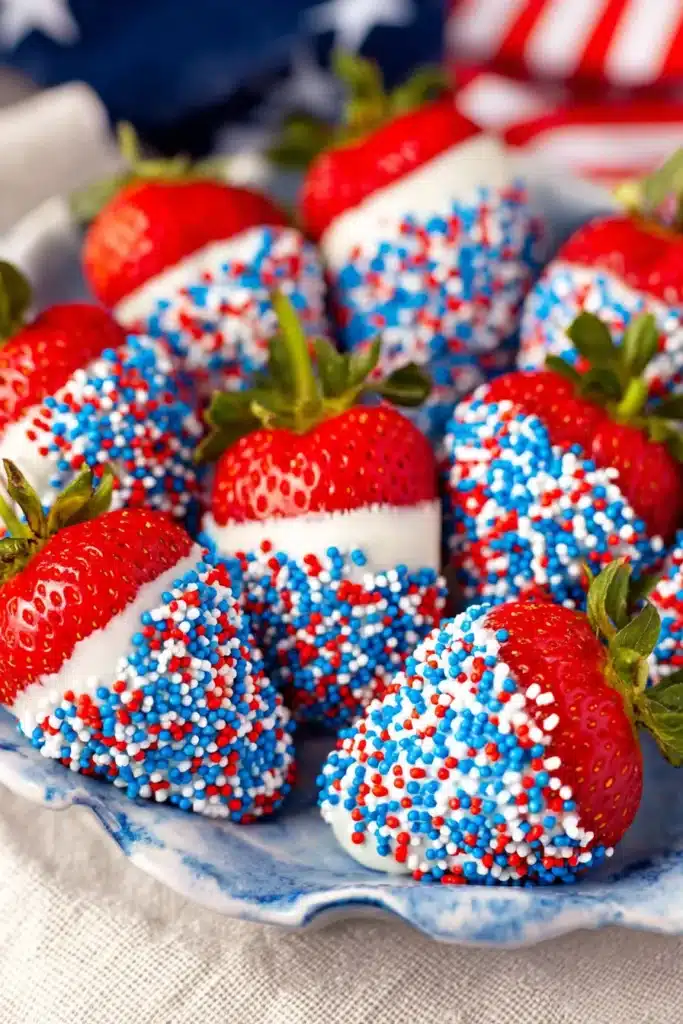 4th of July strawberries dipped in white chocolate with red white and blue sprinkles