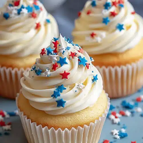 All American Vanilla Cupcakes 3 All American vanilla cupcakes with buttercream frosting and patriotic sprinkles