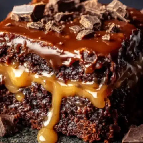Chocolate Caramel Dump Cake 5 Chocolate caramel dump cake slice with gooey caramel filling and rich chocolate ganache topping