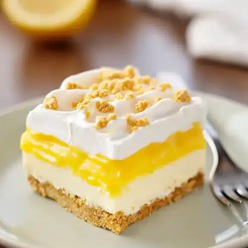 Heavenly Lemon Oreo Dessert: Creamy, Refreshing, and Easy No Bake Treat 3 Heavenly Lemon Oreo Dessert slice with creamy lemon layers and Golden Oreo crust