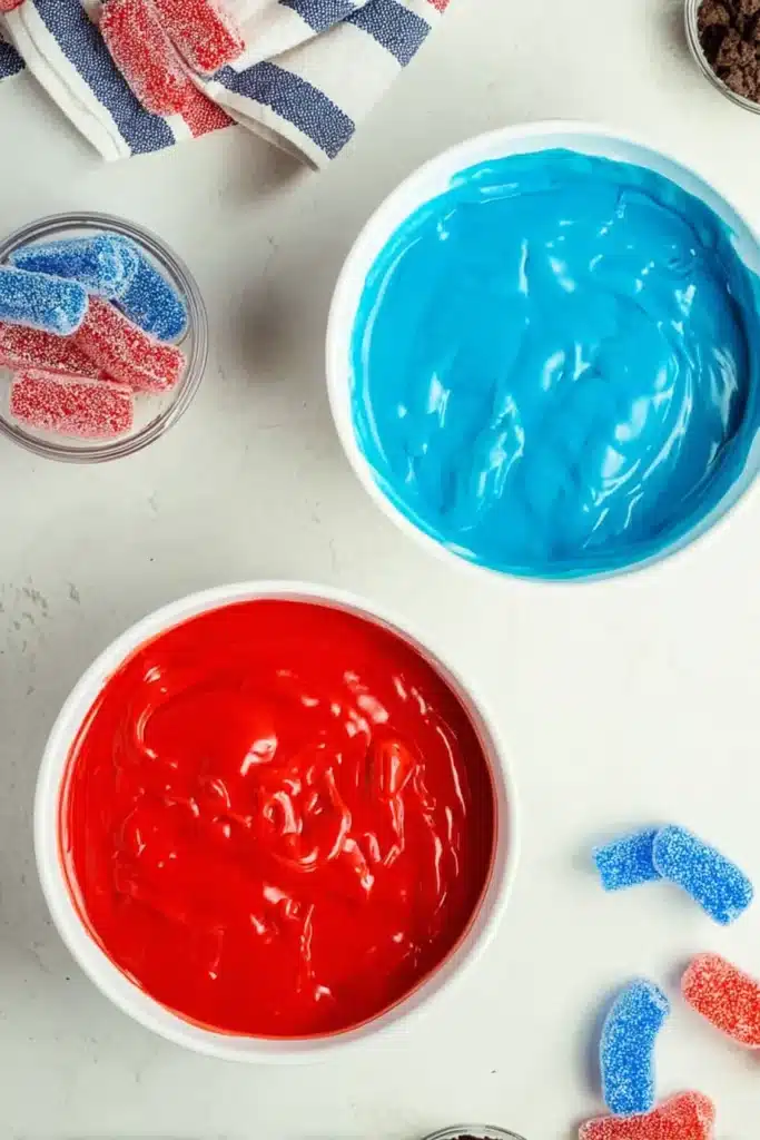 Red White and Blue Dirt Cups pudding layers with patriotic colored cheesecake pudding