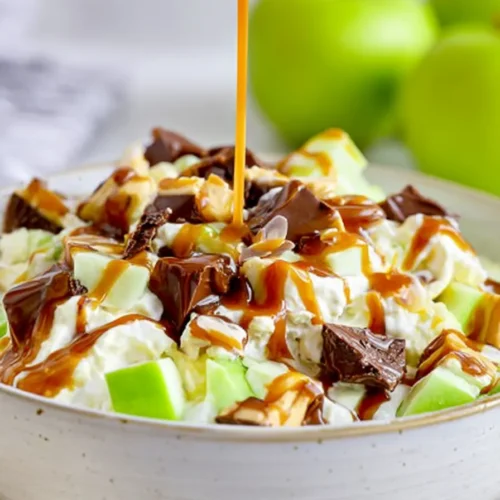 Snickers Salad with caramel drizzle and candy bars