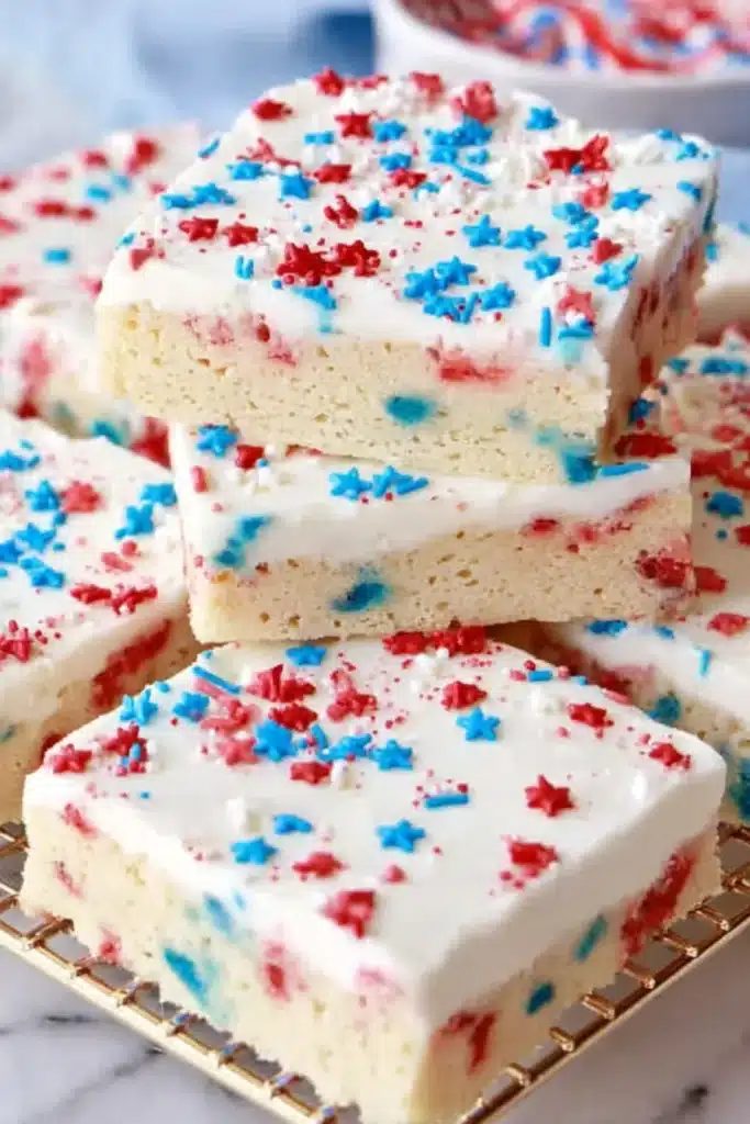 Patriotic Sugar Cookie Bars for the Perfect 4th of July Dessert 5 Patriotic sugar cookie bars with creamy frosting and star sprinkles