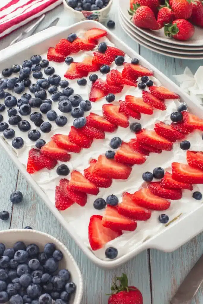 Strawberry Jello Flag Cake with berries for 4th of July