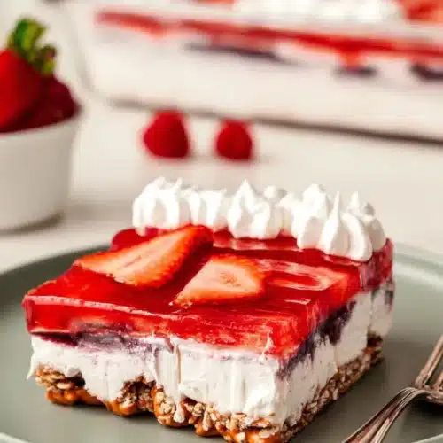 Strawberry Pretzel Jello Salad Recipe for the Perfect 4th of July Dessert 4 Strawberry Pretzel Jello Salad slice with creamy filling and crunchy pretzel crust